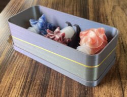 The shiny three-color box for a set of three stoppers has tiny sparkles in it.