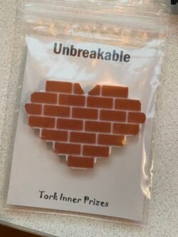 “Unbreakable Heart” Pin of a heart shaped section of brick wall